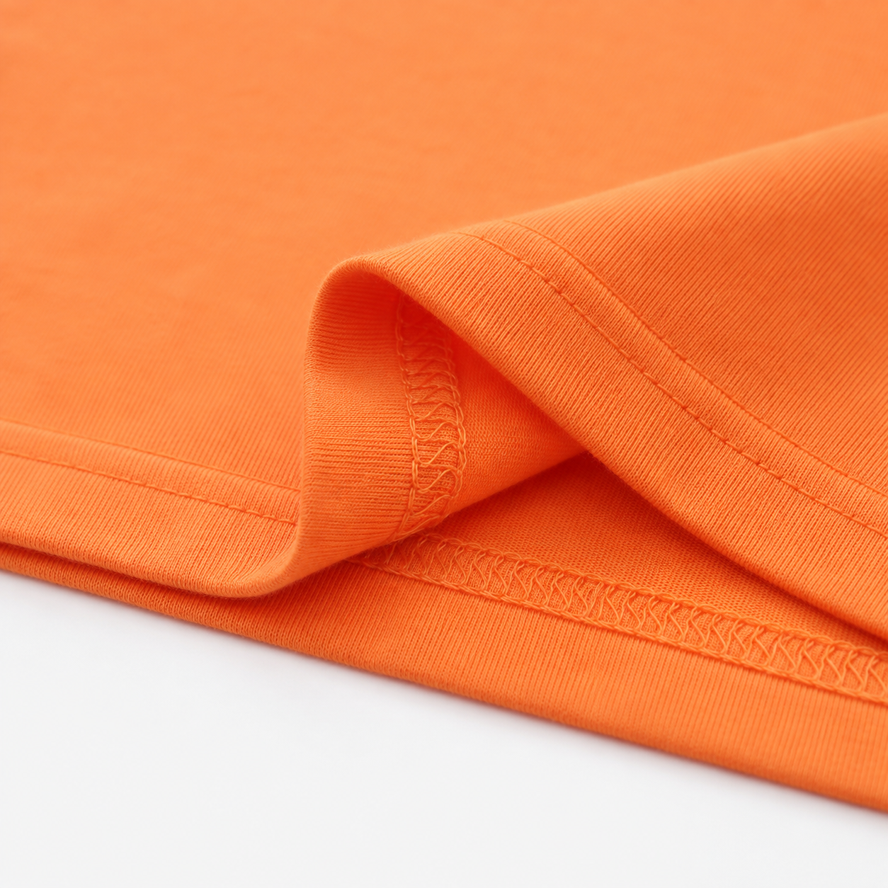 Close-up of the soft cotton fabric and hem stitching detail.