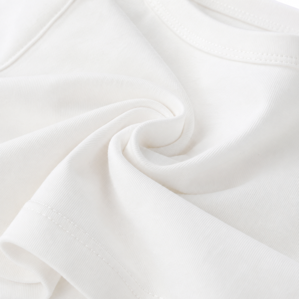 Close-up of the soft white cotton fabric texture.