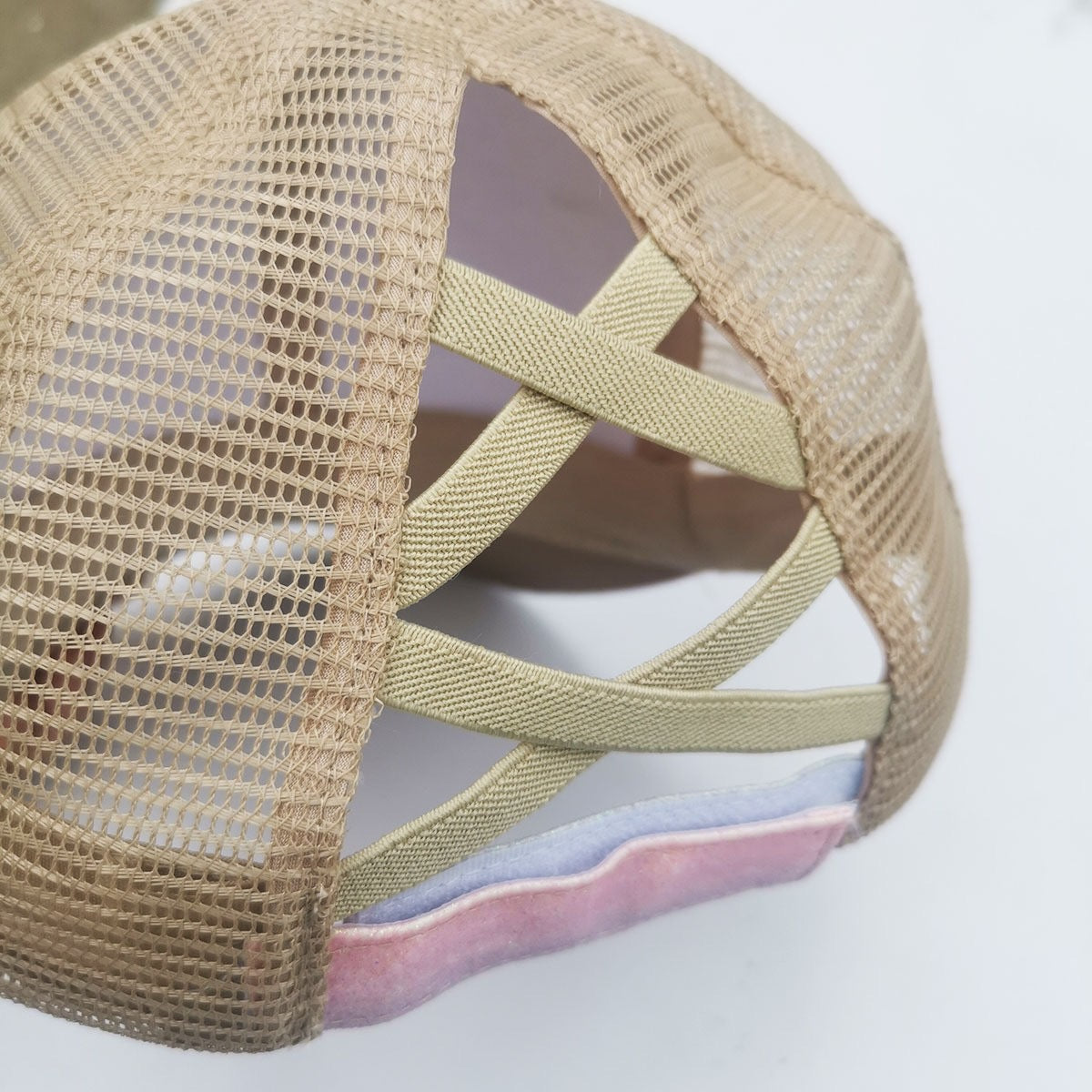 Back detail of the Pastel Glow Ponytail Trucker Hat with ponytail opening and mesh panels.