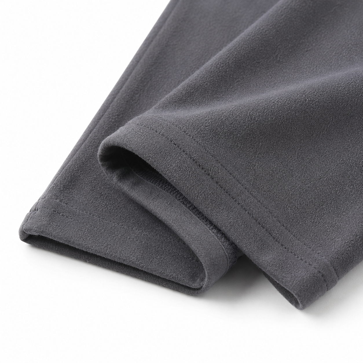 Close-up of the ankle hem and cotton fabric on the charcoal gray girls leggings.