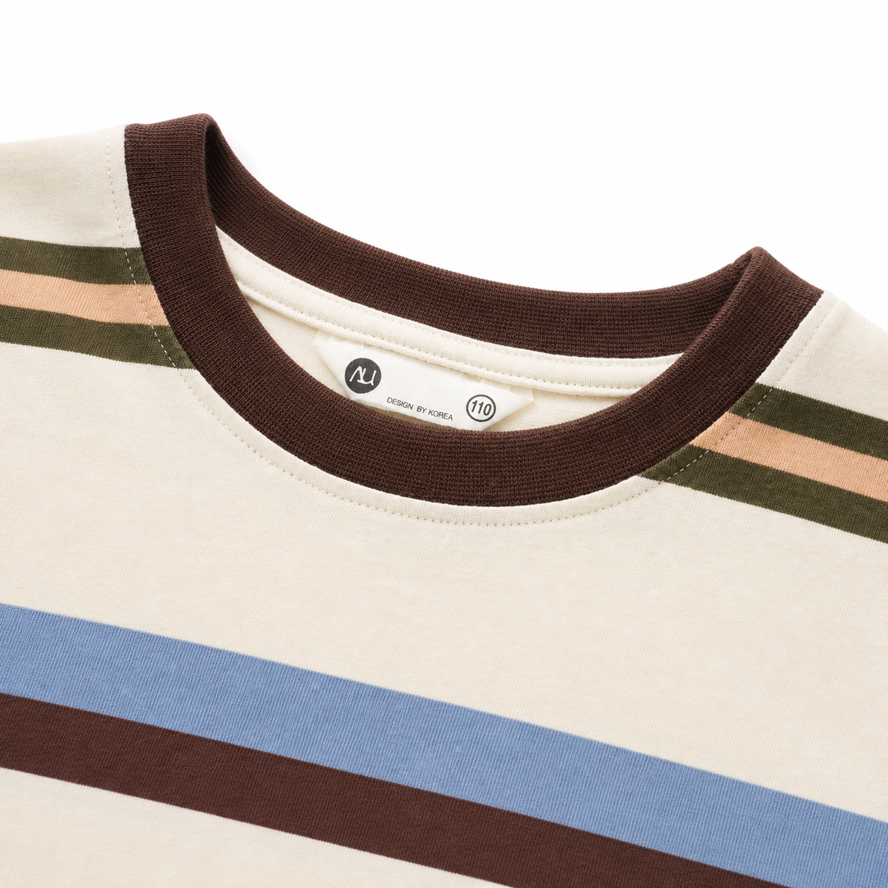 Close-up of the brown ribbed crew neckline and stitching on the cream striped boys T-shirt.