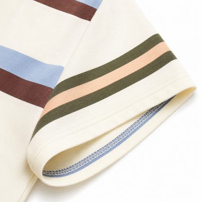 Close-up of the short sleeve hem and stripe alignment on the cream cotton-blend boys T-shirt.