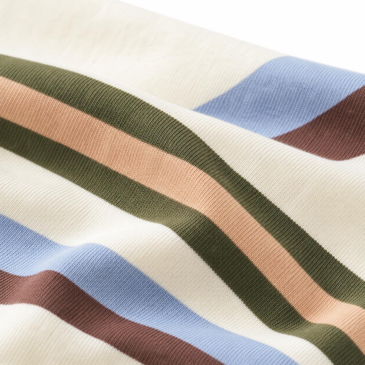 Close-up of the cream cotton-blend knit fabric with blue, brown, olive and blush stripes.