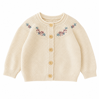 Front flat lay of a cream girls cotton cardigan with floral embroidery and button front.
