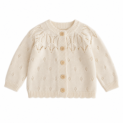 Front view of a cream girls cotton knit cardigan with five buttons, openwork leaf detailing and ribbed trim.