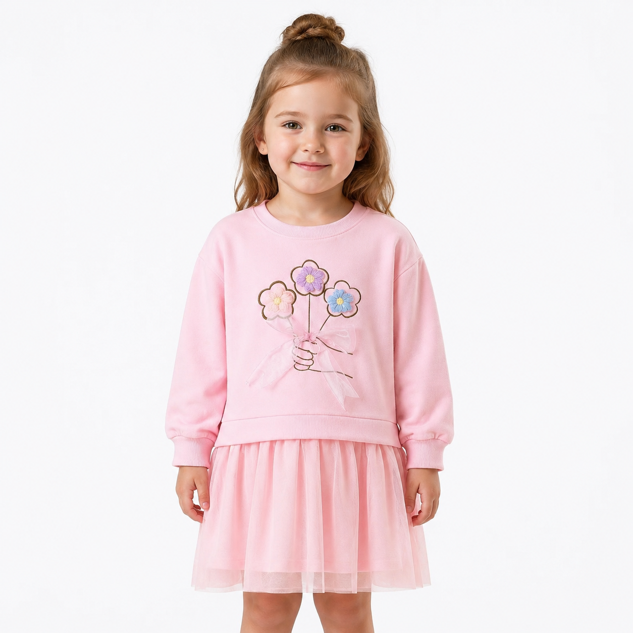 Girl model wearing a pink cotton dress on a clean studio background.