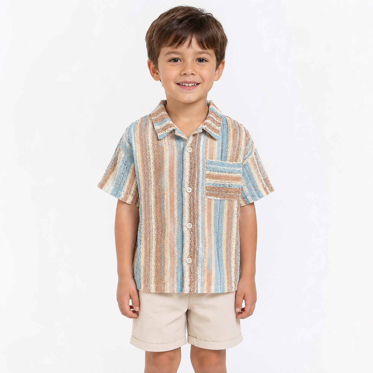 Boy model wearing pastel stripe boys shirt and shorts set on a white background.