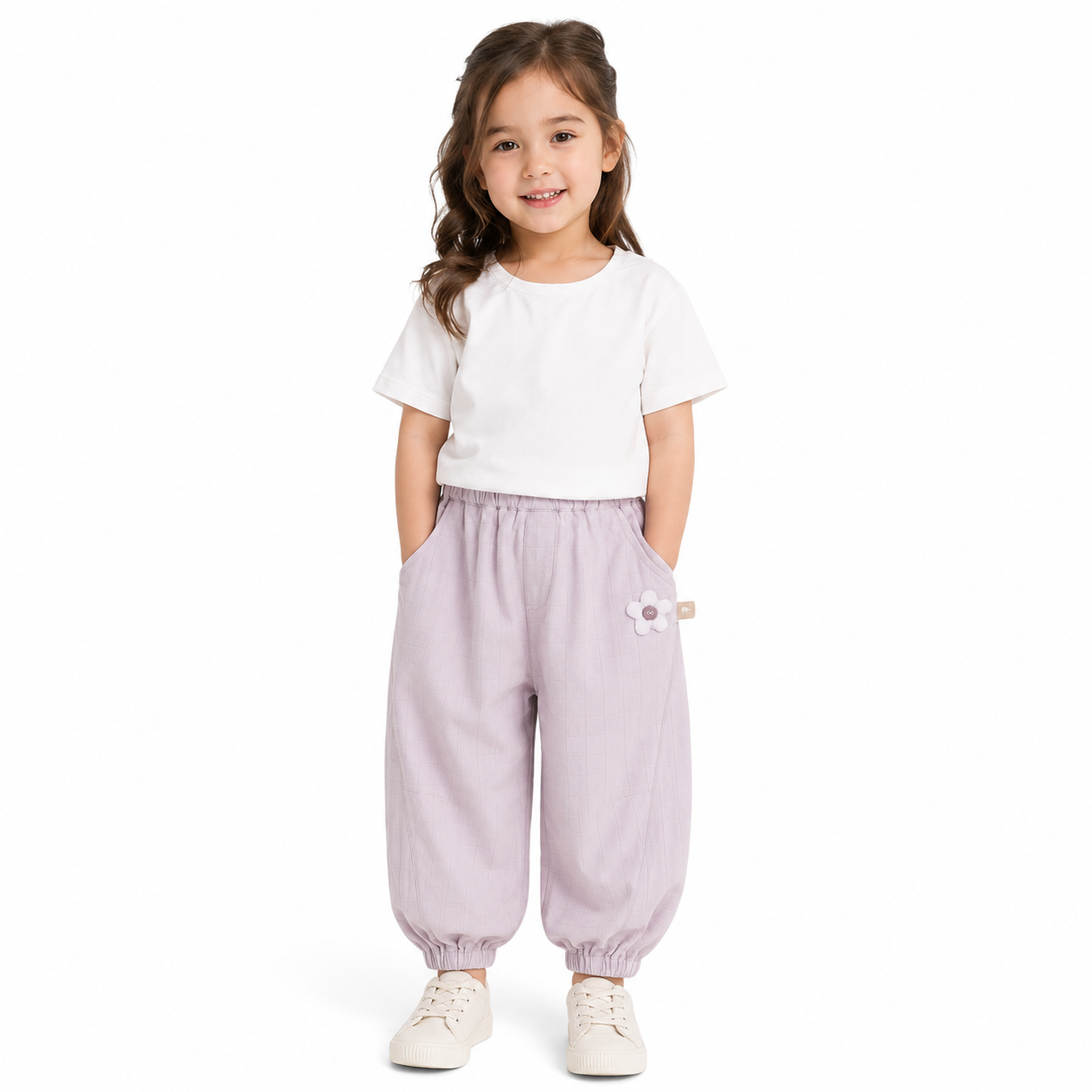 Girl wearing purple balloon pants on a white background