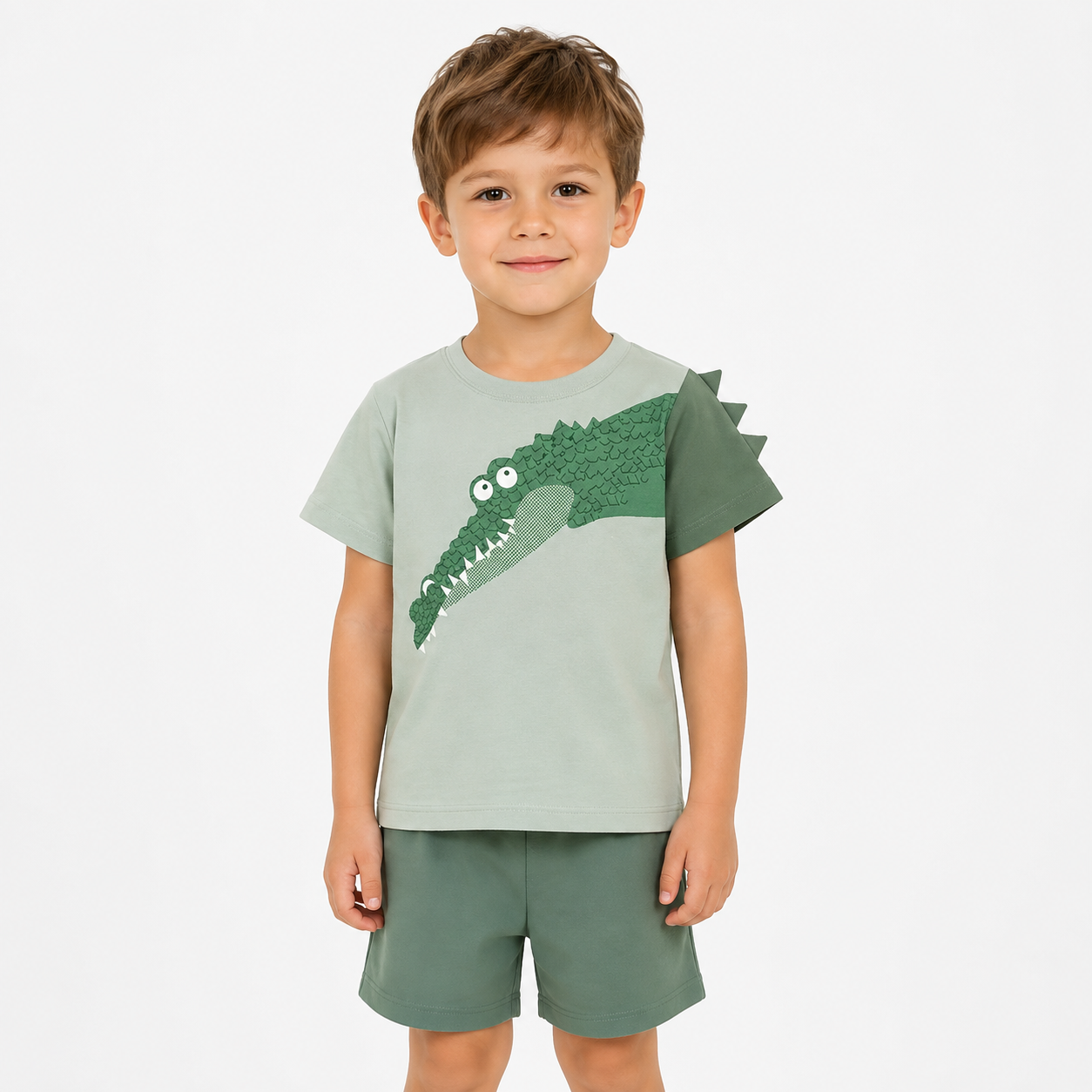 Boy model wearing a green cotton shorts set.