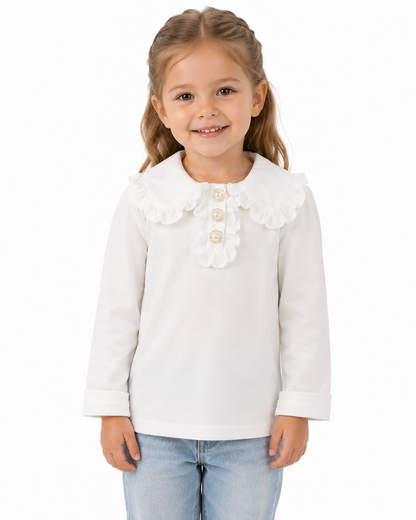 Girl model wearing a white long sleeve cotton top with a ruffle collar on a white studio background.