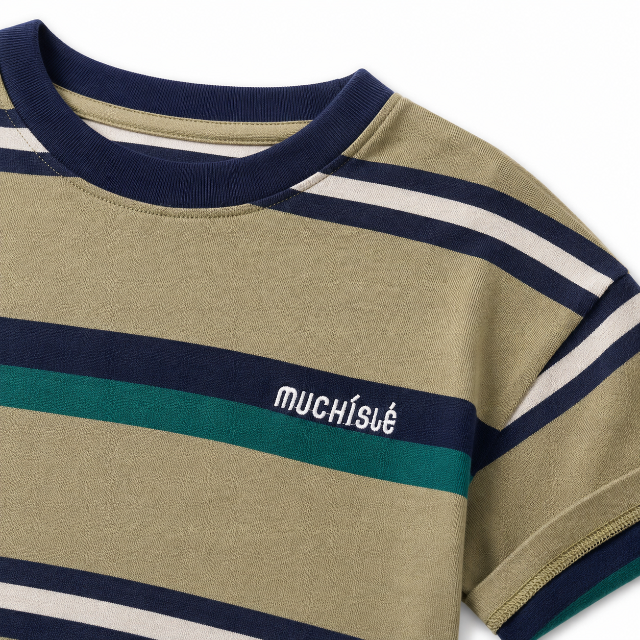 Close-up of the white embroidered chest detail on the olive, navy and teal striped T-shirt.