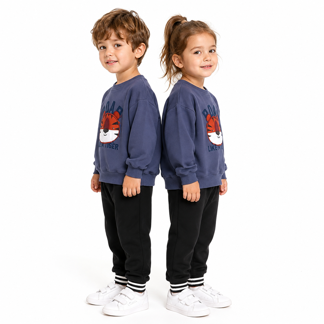 Child models wearing the blue and black kids cotton sweatshirt set on a white studio background.