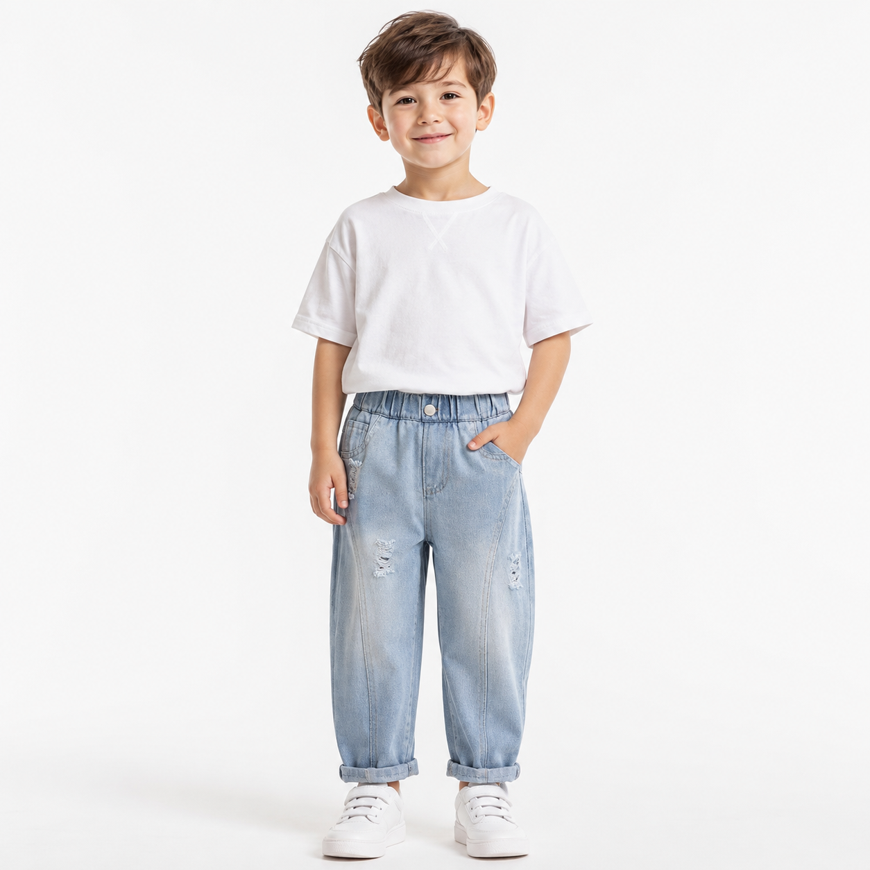 Child model wearing light blue boys denim joggers on a white studio background.