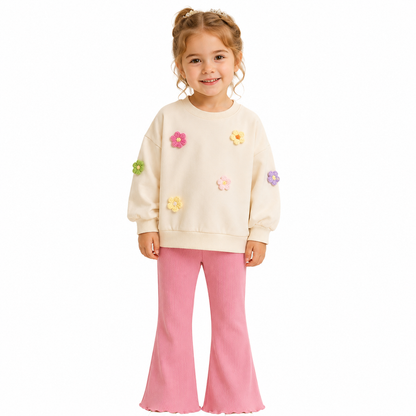 Girl model wearing a cream and pink cotton lounge set on a white studio background.