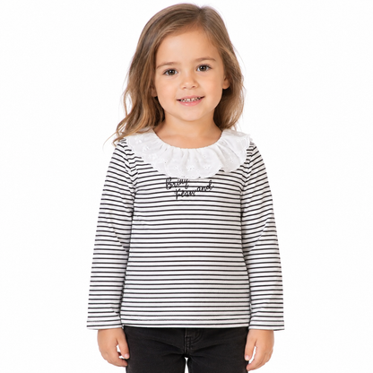 Girl model wearing a black and white striped long sleeve ruffle top on a white studio background.