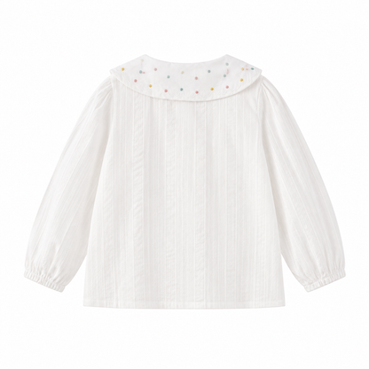 Back view of the white girls cotton blouse with long sleeves and decorated scalloped collar.