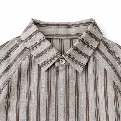 Collar and neckline detail of boys striped short sleeve shirt.