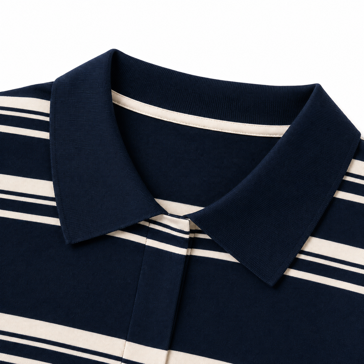 Close-up of the collar detail on a navy striped girls polo shirt.