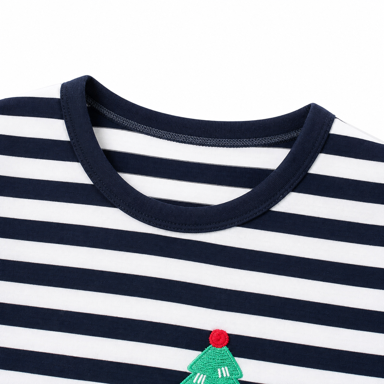 Close-up of the round neckline and striped cotton fabric detail.