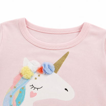 Close-up of the neckline and upper unicorn detail on a pink girls cotton top.