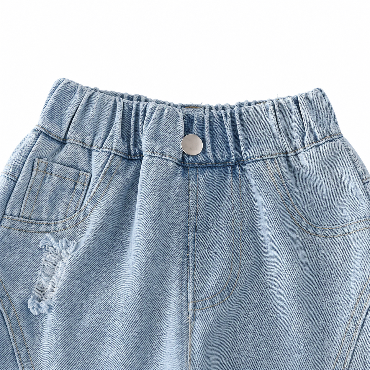 Close-up of the elastic waistband and pocket detail on boys light wash denim joggers.