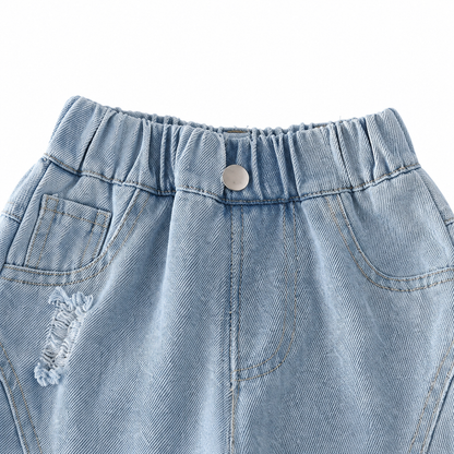 Close-up of the elastic waistband and pocket detail on boys light wash denim joggers.