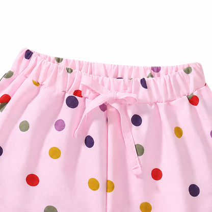 Close-up of elastic waistband detail on girls cotton shorts.