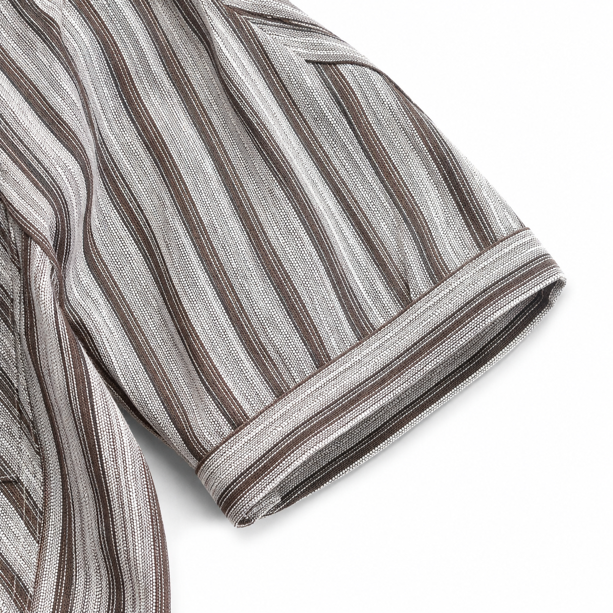 Sleeve cuff detail of boys striped shirt.