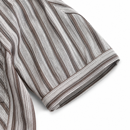 Sleeve cuff detail of boys striped shirt.