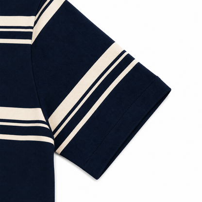 Close-up of the sleeve detail on a navy striped girls short sleeve top.