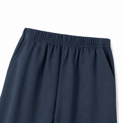Close-up of the elastic waistband detail on the navy pants.