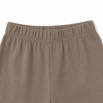 Close-up of the elastic waistband on the taupe pants from the girls cotton set.