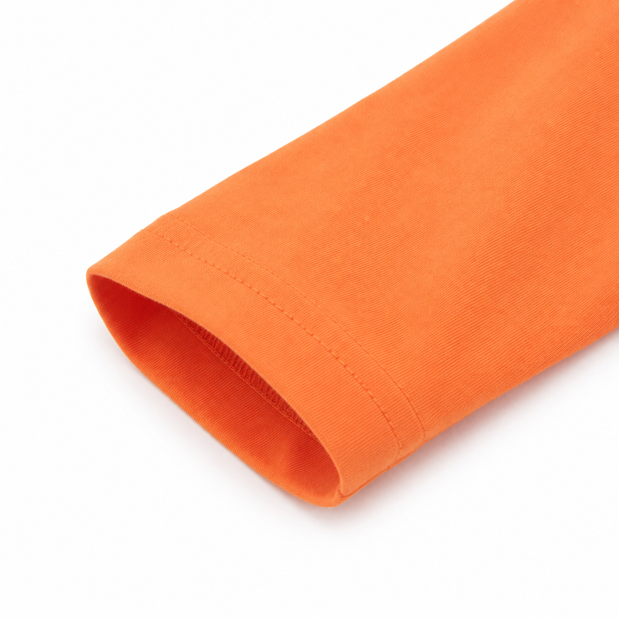 Close-up of the sleeve detail on the orange boys long sleeve tee.