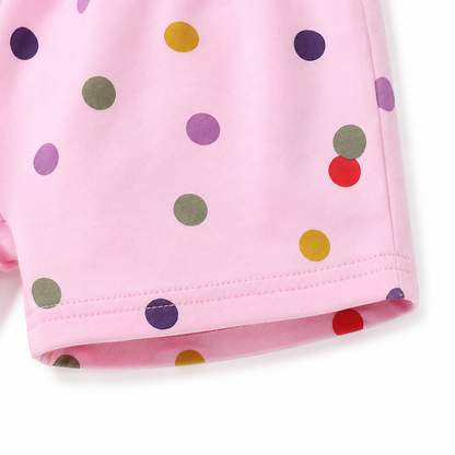 Close-up of hem stitching detail on pink cotton shorts.