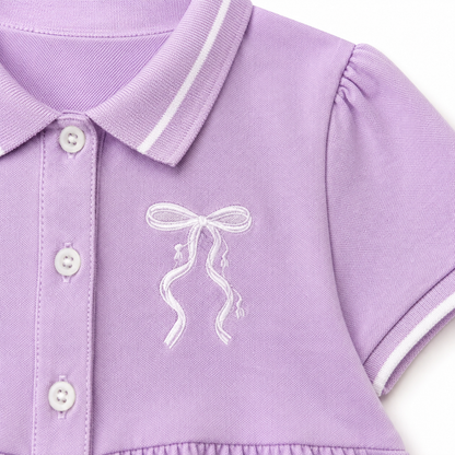 Lavender bow embroidery detail on girls polo dress