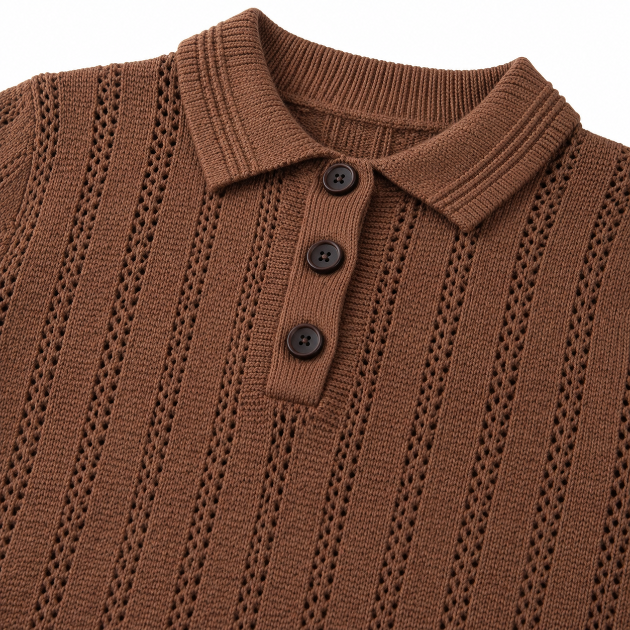 Detailed view of the three dark buttons and textured front placket on the chocolate-brown knit polo.