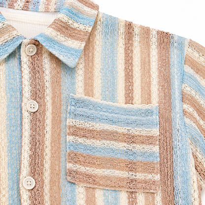 Pocket and stripe detail of boys textured short sleeve shirt.