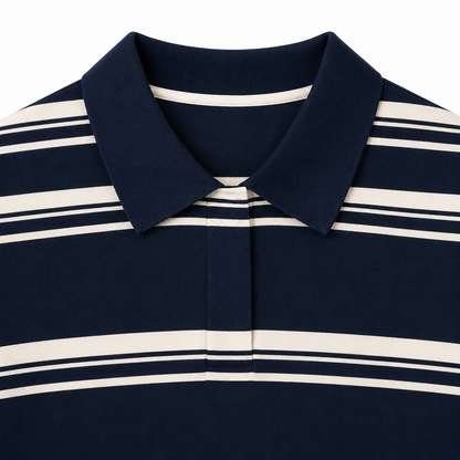 Close-up of the placket and stripe detail on a navy striped girls polo top.