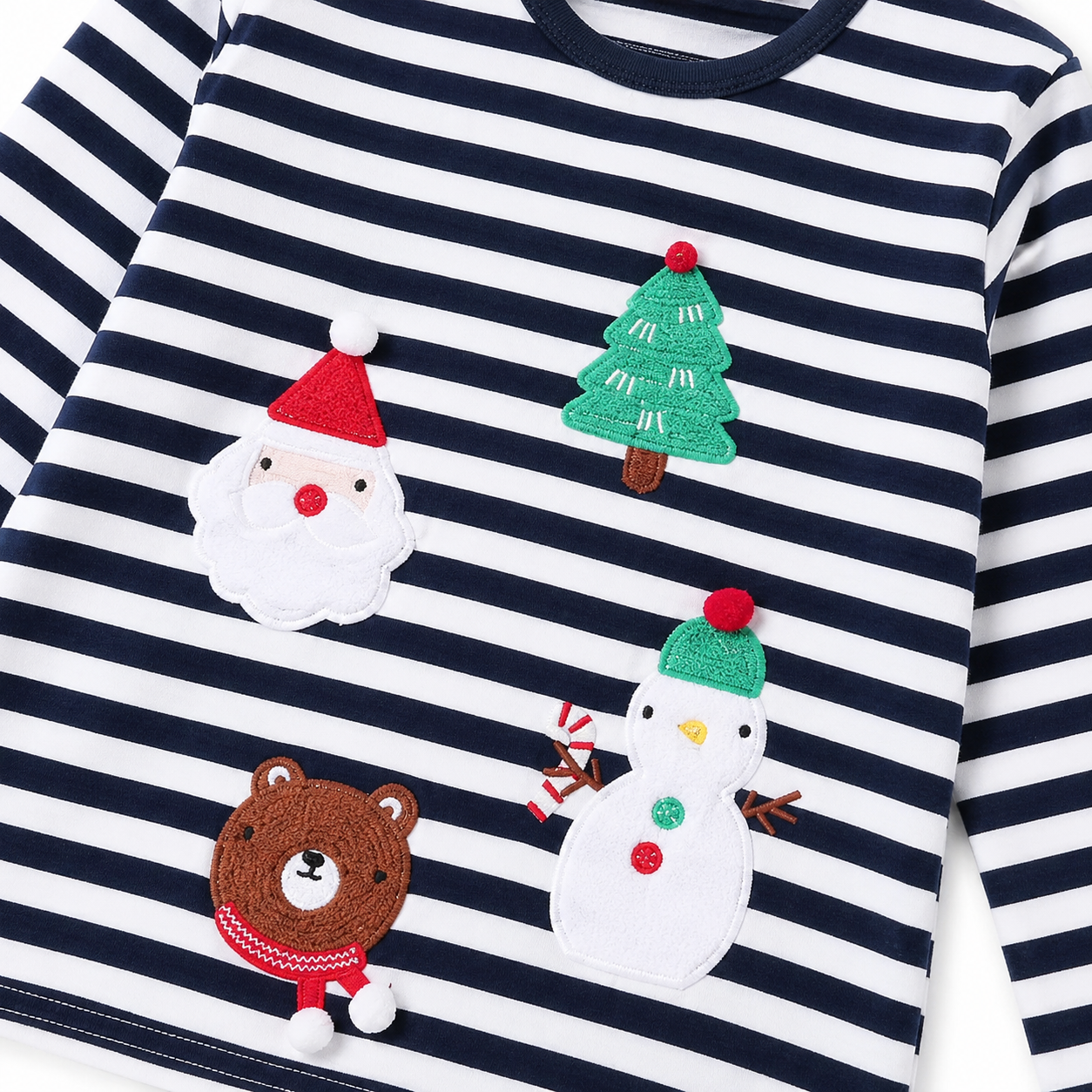 Close-up of the festive applique detail on the striped top.