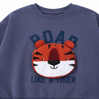 Close-up of the tiger applique graphic detail on the sweatshirt.