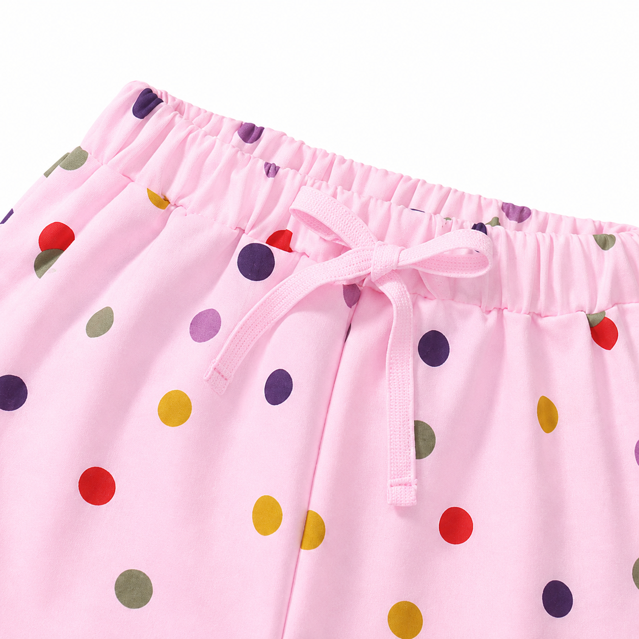 Close-up of colorful confetti print detail on girls shorts.