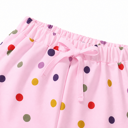 Close-up of colorful confetti print detail on girls shorts.