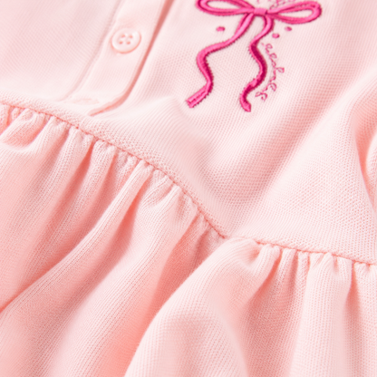 Pink cotton fabric detail of girls polo dress