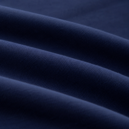 Close-up of the navy cotton blend fabric texture on the girls long sleeve dress.