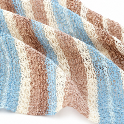 Fabric texture detail of boys pastel stripe shirt.