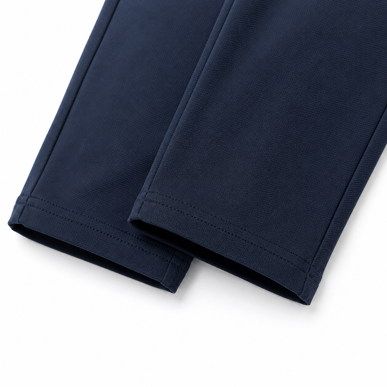 Close-up of the pant hem detail on the matching navy pants.