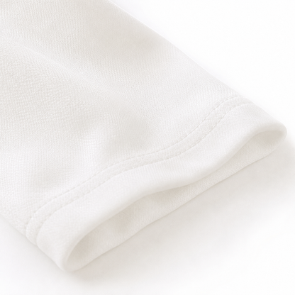 Close-up of the cotton fabric texture on a white girls top.