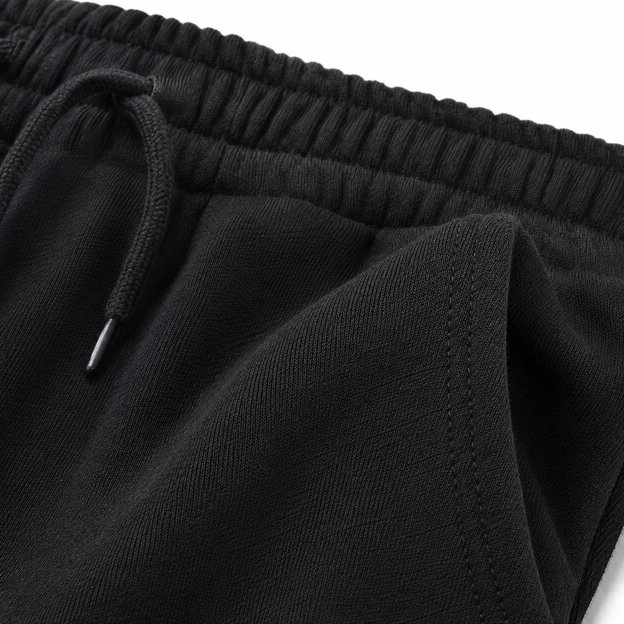 Black kids cotton joggers fabric texture detail