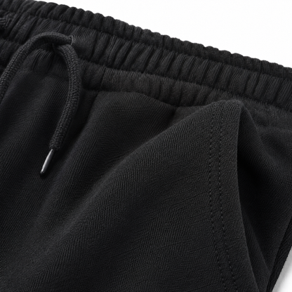 Black kids cotton joggers fabric texture detail