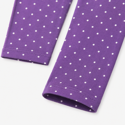 Close-up of the purple pants with small white polka dots and finished hems.